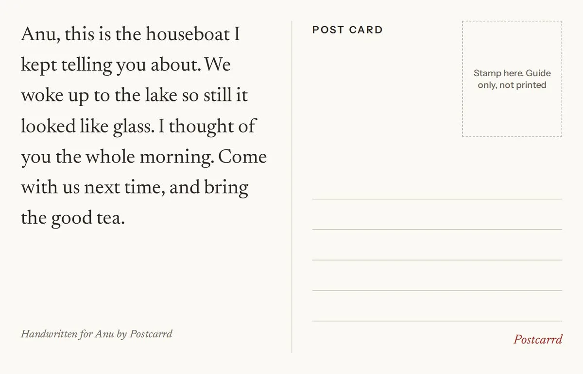 The back of an open postcard: a handwritten message on the left, a stamp box and blank address lines on the right.