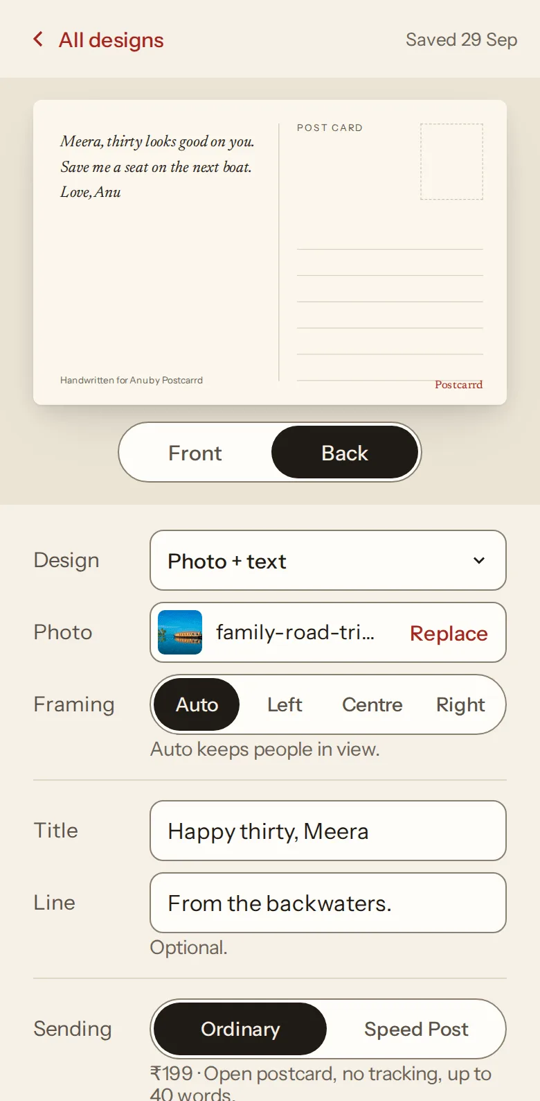 The editor on a phone with the card turned to its back, where the message is written.